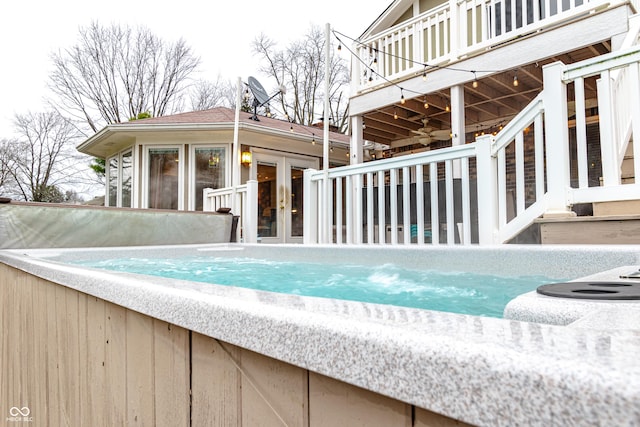 view of pool featuring french doors