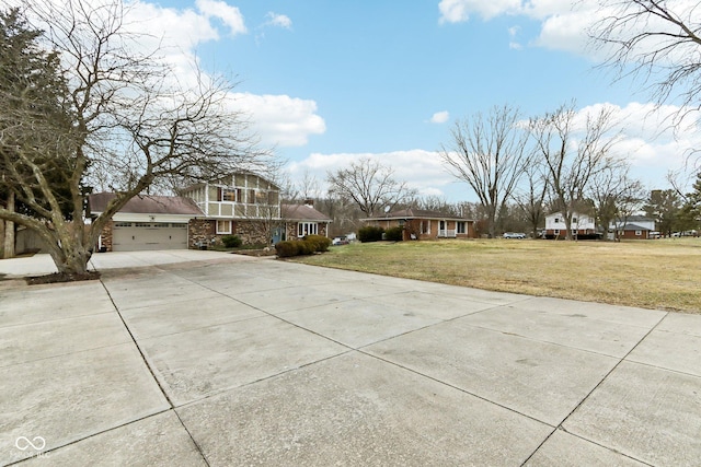 view of front of home with a garage and a front yard