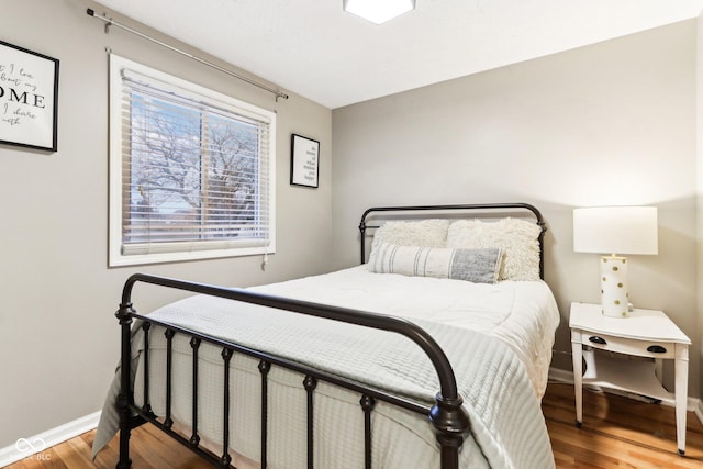 bedroom featuring hardwood / wood-style floors