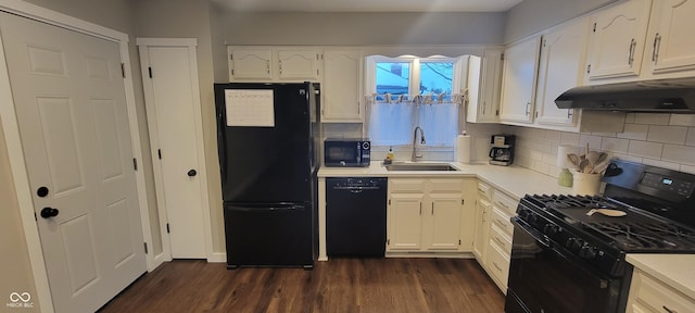 kitchen featuring sink, white cabinetry, and black appliances