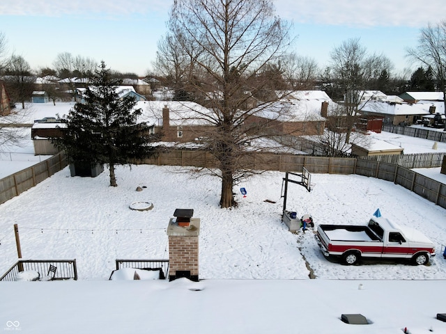 view of yard layered in snow