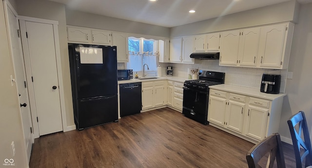 kitchen with sink, backsplash, white cabinets, and black appliances