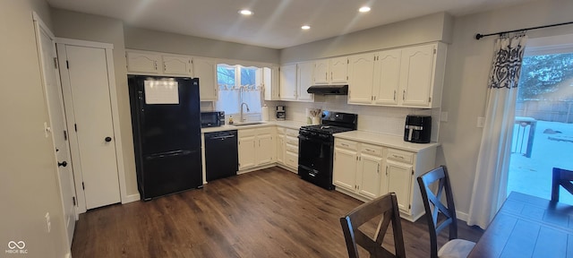 kitchen featuring sink, white cabinetry, backsplash, a healthy amount of sunlight, and black appliances