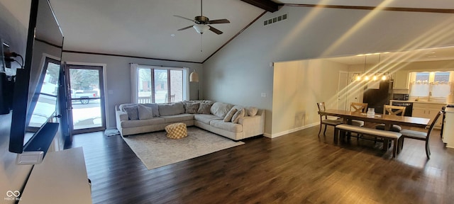 living room with ceiling fan with notable chandelier, high vaulted ceiling, beam ceiling, and dark hardwood / wood-style floors