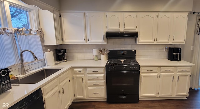 kitchen featuring black appliances, decorative backsplash, dark hardwood / wood-style floors, sink, and white cabinetry