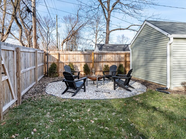 view of yard with an outdoor fire pit