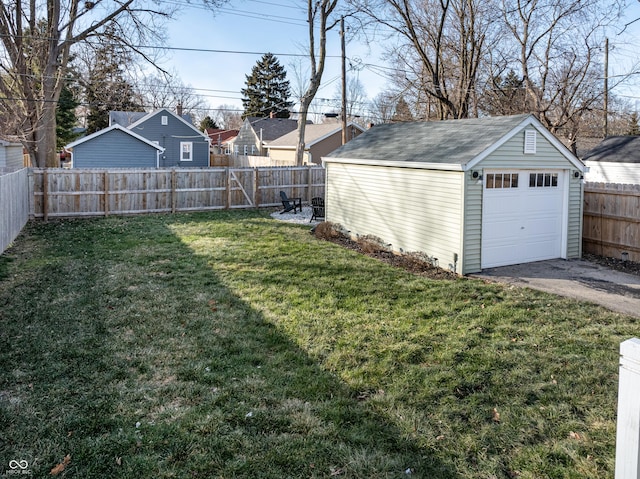 view of yard with an outbuilding and a garage