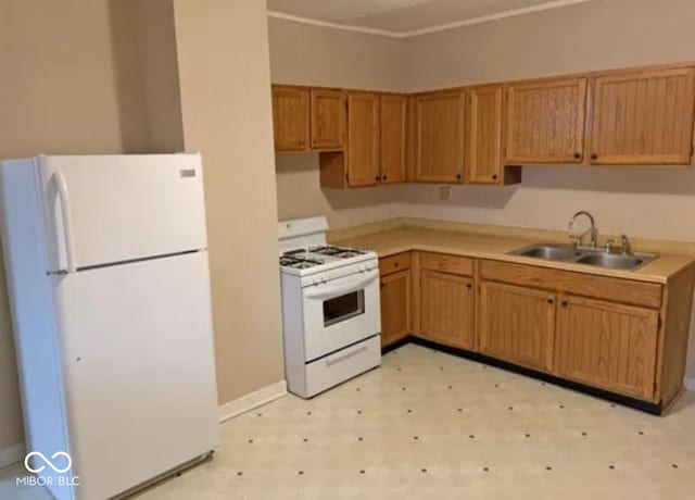 kitchen with white appliances and sink