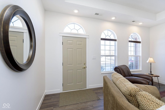 entryway with recessed lighting, visible vents, baseboards, and dark wood-type flooring