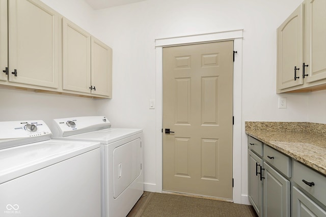 clothes washing area with cabinet space and washer and clothes dryer