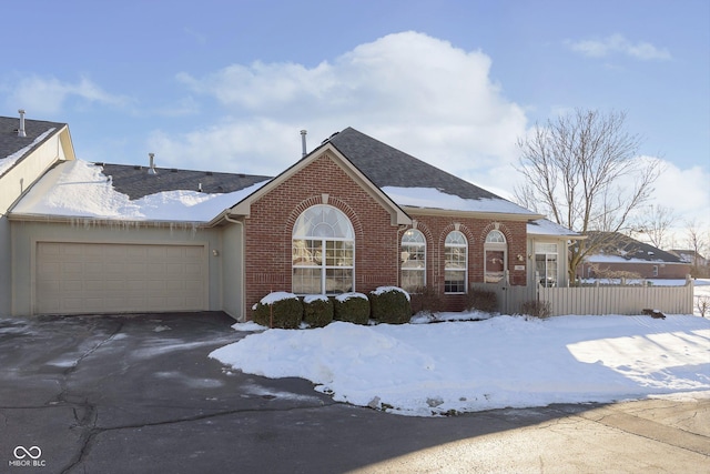 view of front of property with a garage