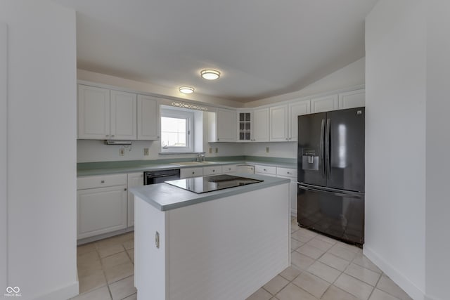 kitchen featuring light tile patterned floors, white cabinets, black appliances, and light countertops