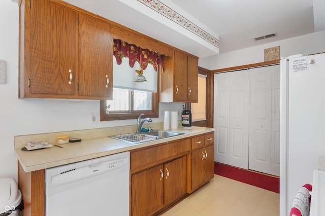 kitchen with sink and white appliances