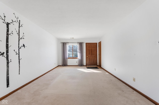 empty room with light colored carpet