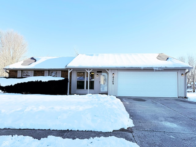 ranch-style house featuring a garage