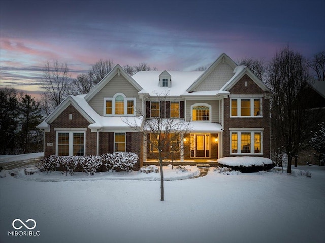 view of snow covered house