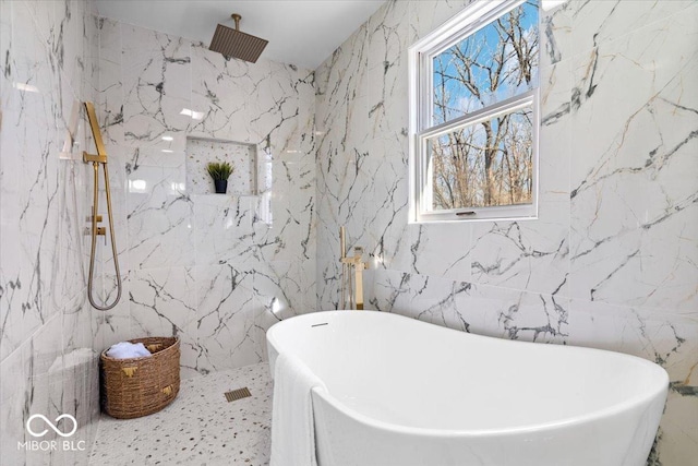 bathroom featuring tile walls and plus walk in shower