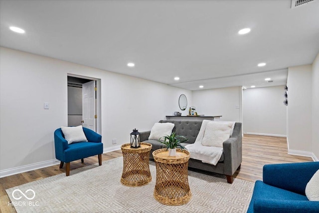 living room with light hardwood / wood-style floors