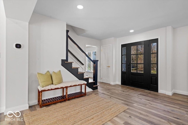 foyer entrance with light hardwood / wood-style flooring