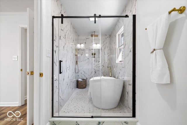 bathroom featuring separate shower and tub and hardwood / wood-style floors