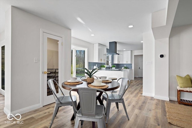 dining space featuring light wood-type flooring