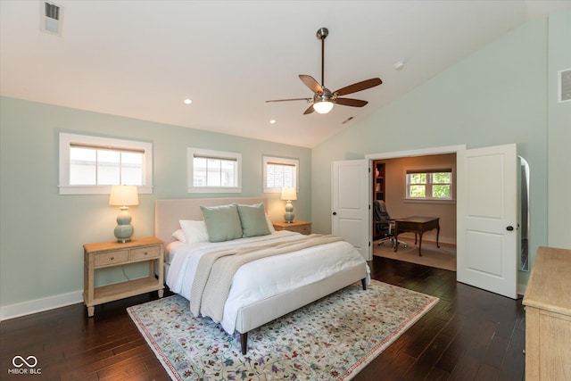 bedroom featuring dark hardwood / wood-style flooring, multiple windows, high vaulted ceiling, and ceiling fan