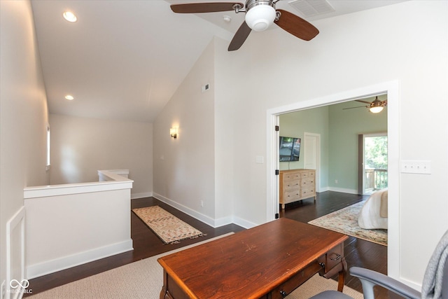 office space featuring ceiling fan, dark wood-type flooring, and lofted ceiling