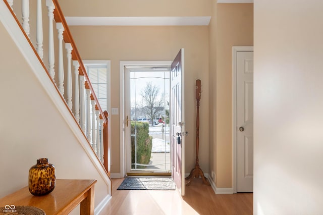 entryway with light wood-type flooring and a healthy amount of sunlight