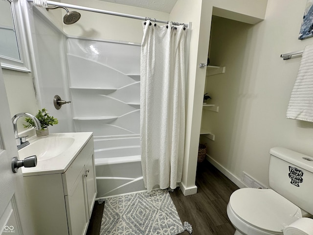 full bathroom with toilet, vanity, shower / bath combo, and hardwood / wood-style floors