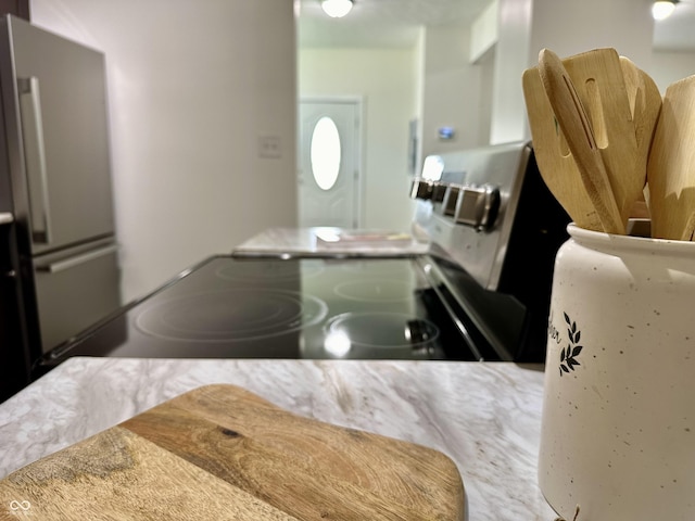 kitchen featuring stainless steel refrigerator