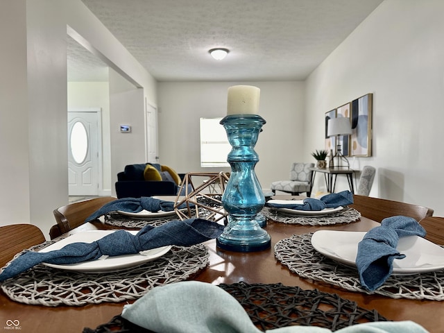 interior space featuring a textured ceiling and hardwood / wood-style floors