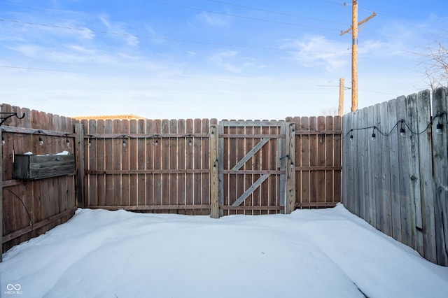 view of yard layered in snow