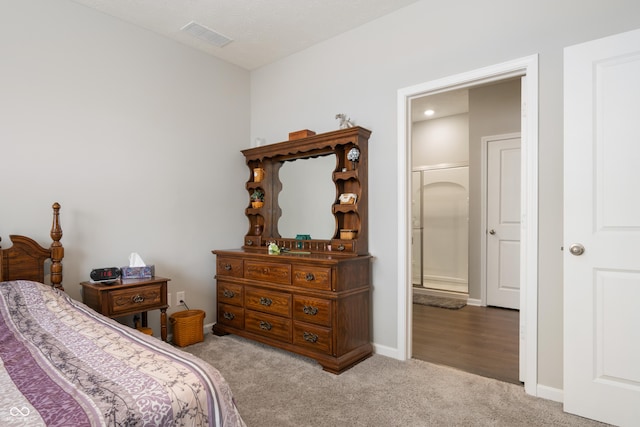 bedroom featuring light colored carpet