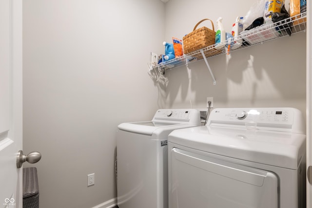 laundry room with washing machine and clothes dryer