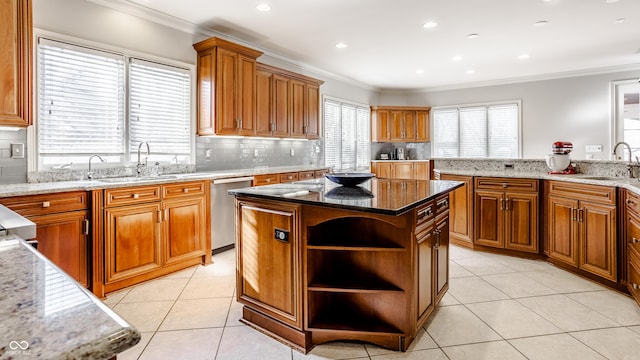 8526 Oakmont Ln, Indianapolis, IN 46260 - kitchen featuring a kitchen island, dishwasher, sink, light tile patterned floors, and light stone counters