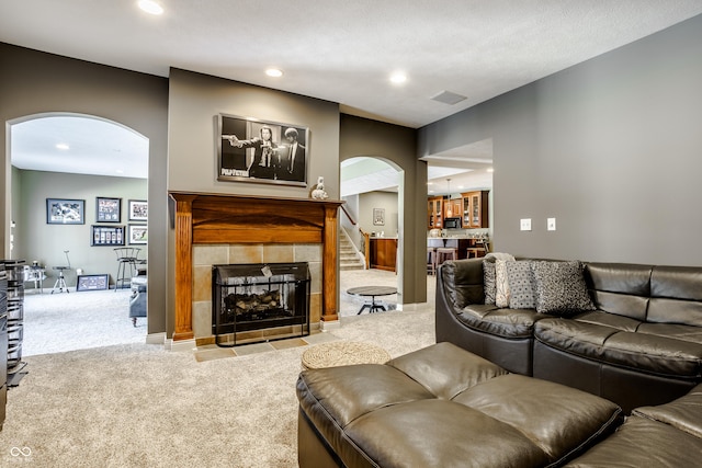 8526 Oakmont Ln, Indianapolis, IN 46260 - living room featuring a tile fireplace and light carpet