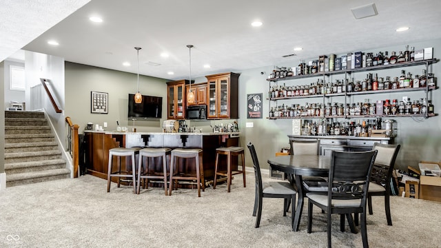 8526 Oakmont Ln, Indianapolis, IN 46260 - bar with pendant lighting, light carpet, and light stone countertops