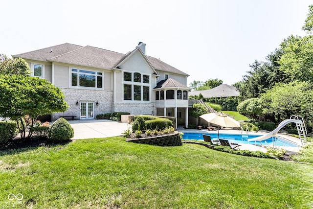 8526 Oakmont Ln, Indianapolis, IN 46260 - back of house with a patio, a lawn, and french doors