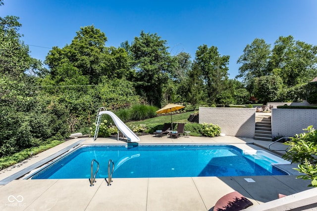 8526 Oakmont Ln, Indianapolis, IN 46260 - view of pool with a patio and a water slide