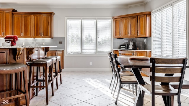 8526 Oakmont Ln, Indianapolis, IN 46260 - kitchen with crown molding, a healthy amount of sunlight, and backsplash