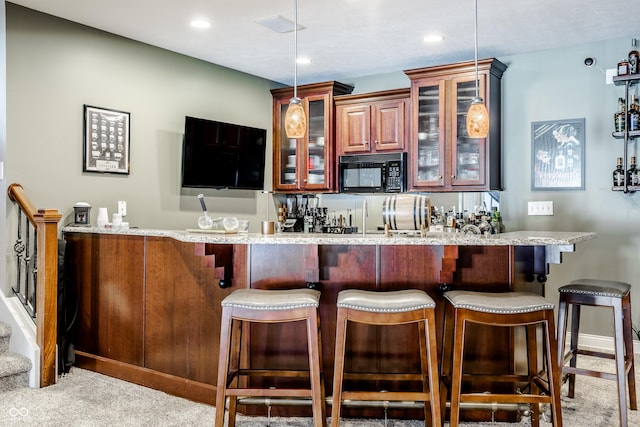 8526 Oakmont Ln, Indianapolis, IN 46260 - bar with pendant lighting, light stone countertops, and light carpet