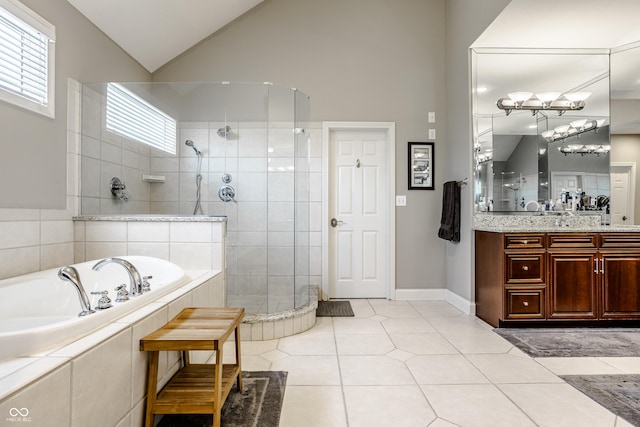 8526 Oakmont Ln, Indianapolis, IN 46260 - bathroom featuring vaulted ceiling, vanity, tile patterned floors, and plus walk in shower