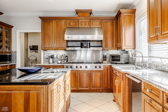 8526 Oakmont Ln, Indianapolis, IN 46260 - kitchen featuring stainless steel appliances, ornamental molding, light stone countertops, light tile patterned flooring, and exhaust hood
