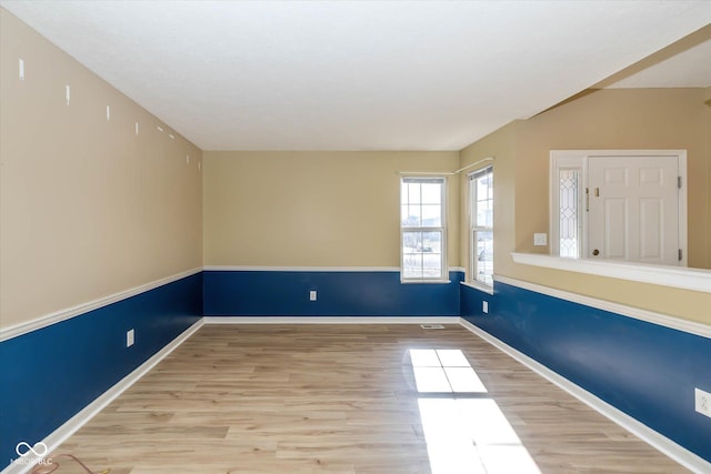 unfurnished room featuring light wood-type flooring