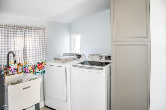 clothes washing area featuring washer and clothes dryer