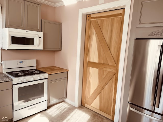 kitchen featuring gray cabinets and white appliances