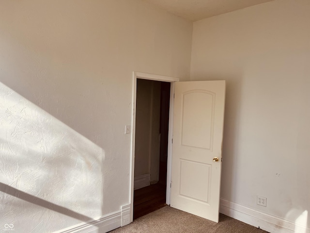 unfurnished room with carpet flooring