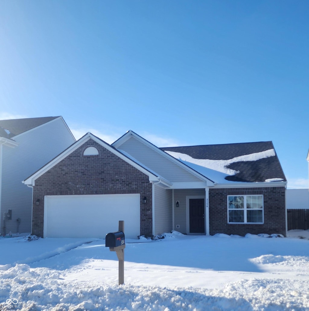 ranch-style home featuring a garage