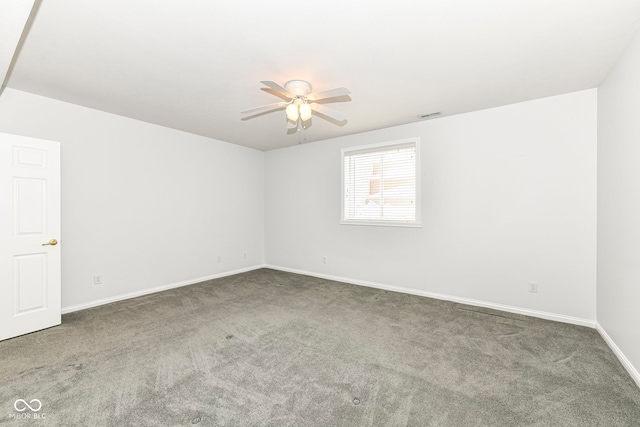 empty room featuring ceiling fan and carpet flooring