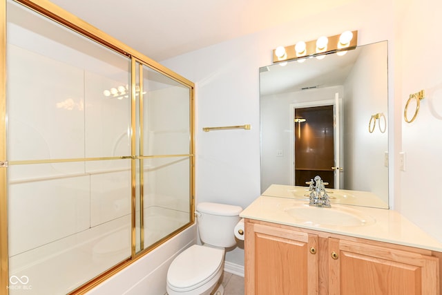 full bathroom with shower / bath combination with glass door, vanity, and toilet